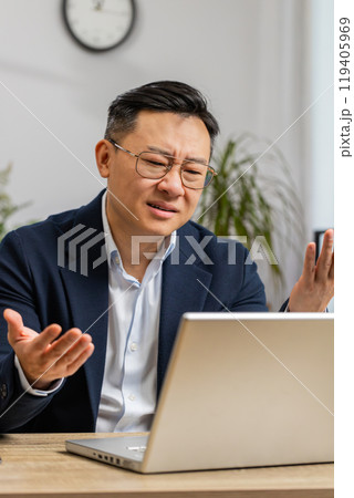 Business man working on laptop loses becoming surprised sudden lottery results bad news fortune loss Business man working on laptop loses becoming surprised sudden lottery results bad news fortune loss 119405969