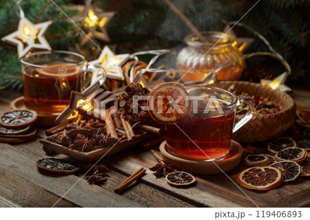 Christmas herbal tea with ingredients on a old wooden table. Christmas herbal tea with ingredients on a old wooden table. 119406893