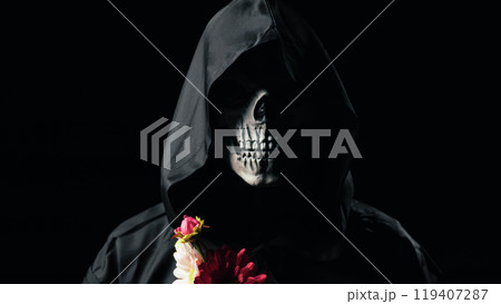 Dead man mask holding the flowers  119407287