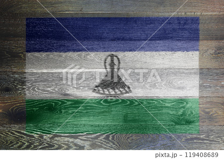 Lesotho flag on rustic old wood surface background 119408689
