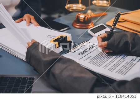 Judge gavel with Justice lawyers having team meeting at law firm background. Concepts of Law and Legal services. 119414053