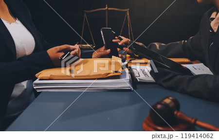 Judge gavel with Justice lawyers having team meeting at law firm background. Concepts of Law and Legal services. Judge gavel with Justice lawyers having team meeting at law firm background. Concepts of Law and Legal services. 119414062