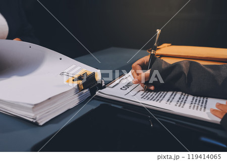 Judge gavel with Justice lawyers having team meeting at law firm background. Concepts of Law and Legal services. 119414065