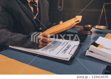 Judge gavel with Justice lawyers having team meeting at law firm background. Concepts of Law and Legal services. 119414070