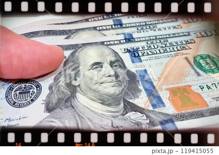 A Fan of $100 Bills.A close-up photo of a fan of $100 US dollar bills. The bills are arranged neatly, with the portrait of Benjamin Franklin visible on each bill.  119415055