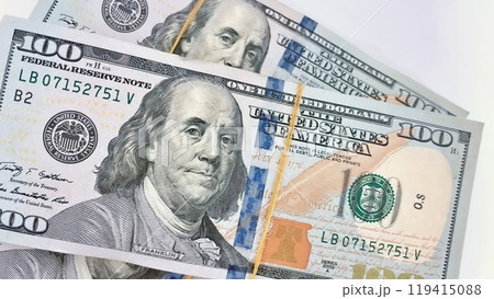 A Fan of $100 Bills.A close-up photo of a fan of $100 US dollar bills. The bills are arranged neatly, with the portrait of Benjamin Franklin visible on each bill. A Fan of $100 Bills.A close-up photo of a fan of $100 US dollar bills. The bills are arranged neatly, with the portrait of Benjamin Franklin visible on each bill. 119415088
