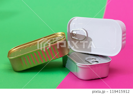 A Group of Stacked Tin Cans on Split Green and Cyan Background A Group of Stacked Tin Cans on Split Green and Cyan Background 119415912