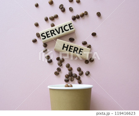 Service here symbol. Concept words Service here on wooden blocks. Beautiful pink background with coffee shop and coffee beans. Business and Service here concept. Copy space. Service here symbol. Concept words Service here on wooden blocks. Beautiful pink background with coffee shop and coffee beans. Business and Service here concept. Copy space. 119416623