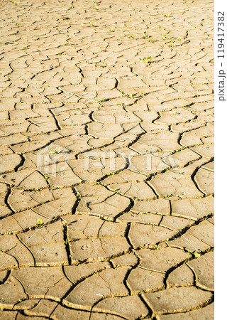 Cracked dry earth background. Heat, drought, climate change concept. 119417382