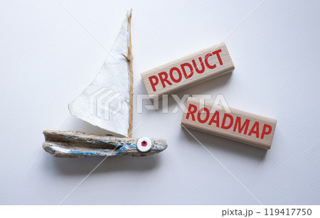 Product Roadmap symbol. Concept word Product Roadmap on wooden blocks. Beautiful white background with boat. Business and Product Roadmap concept. Copy space 119417750