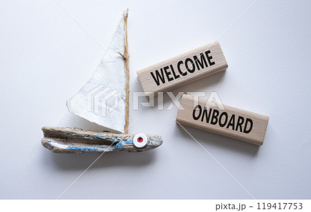 Welcome onboard symbol. Concept words Welcome onboard on wooden blocks. Beautiful white background with boat. Business and Welcome onboard concept. Copy space. 119417753