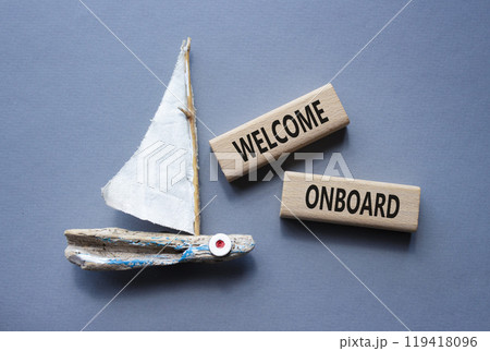 Welcome onboard symbol. Concept words Welcome onboard on wooden blocks. Beautiful grey background with boat. Business and Welcome onboard concept. Copy space. Welcome onboard symbol. Concept words Welcome onboard on wooden blocks. Beautiful grey background with boat. Business and Welcome onboard concept. Copy space. 119418096
