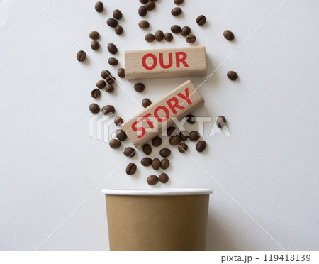 Our story symbol. Wooden blocks with words Our story Beautiful white background with coffee cup and coffee beans. Business and Our story concept. Copy space. Our story symbol. Wooden blocks with words Our story Beautiful white background with coffee cup and coffee beans. Business and Our story concept. Copy space. 119418139