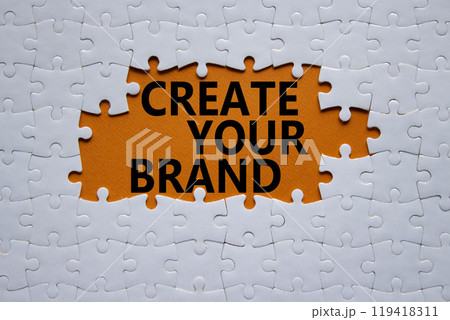 Create your Brand symbol. Concept words Create your Brand on white puzzle. Beautiful orange background. Business and Create your Brand concept. Copy space. Create your Brand symbol. Concept words Create your Brand on white puzzle. Beautiful orange background. Business and Create your Brand concept. Copy space. 119418311