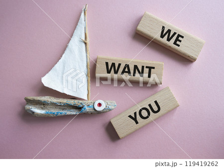We want you symbol. Concept words We want you on wooden blocks. Beautiful pink background with boat. Business and We want you concept. Copy space. 119419262