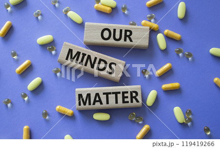 Our Minds Matter symbol. Concept words Our Minds Matter on wooden blocks. Beautiful purple background with pills. Healthcare and Our Minds Matter concept. Copy space. Our Minds Matter symbol. Concept words Our Minds Matter on wooden blocks. Beautiful purple background with pills. Healthcare and Our Minds Matter concept. Copy space. 119419266