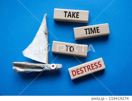 Take time to Destress symbol. Wooden blocks with words Take time to Destress. Beautiful blue background with boat. Business and Take time to Destress concept. Copy space. 119419274