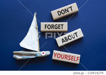 Do not forget about yourself symbol. Concept words Do not forget about yourself on wooden blocks with boat. Beautiful deep blue background. Business concept. Copy space 119419279