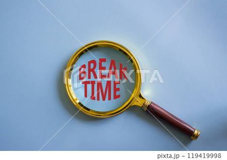 Break Time symbol. Magnifying Glass with Concept word Break Time. Beautiful blue background. Business and Break Time concept. Copy space Break Time symbol. Magnifying Glass with Concept word Break Time. Beautiful blue background. Business and Break Time concept. Copy space 119419998