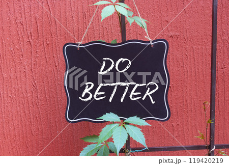 Do Better symbol. Do Better black chalk blackboard. Beautiful red background. Business and Do Better concept. Copy space. 119420219