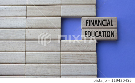 Financial Education symbol. Concept word Financial Education on wooden blocks. Beautiful purple background. Business and Financial Education concept. Copy space 119420453
