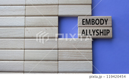 Embody Allyship symbol. Concept word Embody Allyship on wooden blocks. Beautiful purple background. Business and Embody Allyship concept. Copy space 119420454