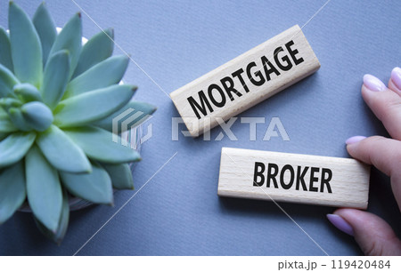 Mortgage Broker symbol. Concept word Mortgage Broker on wooden blocks. Beautiful grey background with succulent plant. Business and Mortgage Broker concept. Copy space Mortgage Broker symbol. Concept word Mortgage Broker on wooden blocks. Beautiful grey background with succulent plant. Business and Mortgage Broker concept. Copy space 119420484