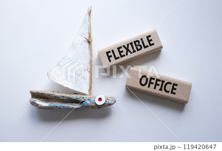 Flexible Office symbol. Concept word Flexible Office on wooden blocks. Beautiful white background with boat. Business and Flexible Office concept. Copy space 119420647