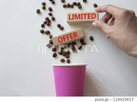 Limited Offer symbol. Concept word Limited Offer on wooden blocks. Businessman hand. Beautiful white background with coffee cup. Business and Limited Offer concept. Copy space Limited Offer symbol. Concept word Limited Offer on wooden blocks. Businessman hand. Beautiful white background with coffee cup. Business and Limited Offer concept. Copy space 119420657