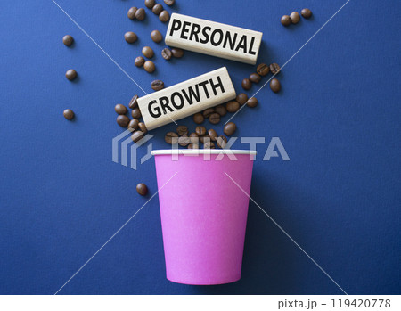 Personal growth symbol. Wooden blocks with words Personal growth. Beautiful deep blue background with coffee cup and coffee beans. Business and Personal growth concept. Copy space. 119420778