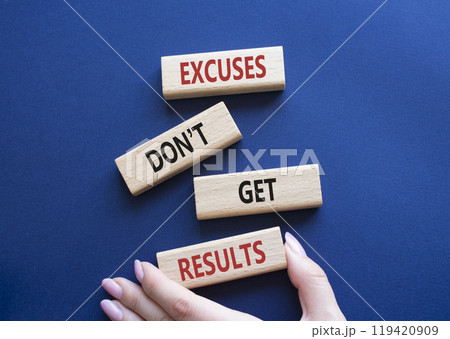 Results symbol. Concept words Excuses do not get results on wooden blocks. Businessman hand. Beautiful deep blue background. Business and Excuses do not get results concept. Copy space Results symbol. Concept words Excuses do not get results on wooden blocks. Businessman hand. Beautiful deep blue background. Business and Excuses do not get results concept. Copy space 119420909