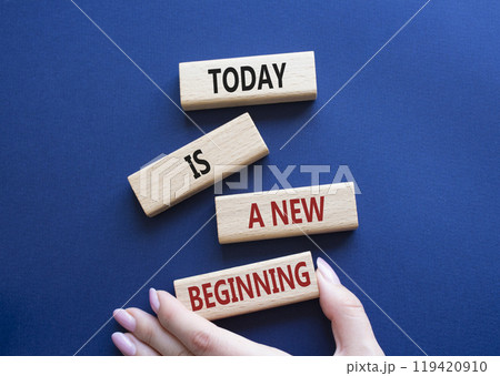 Today is a new beginning symbol. Wooden blocks with words Today is a new beginning. Beautiful deep blue background. Businessman hand. Business and Today is a new beginning concept. Copy space. 119420910