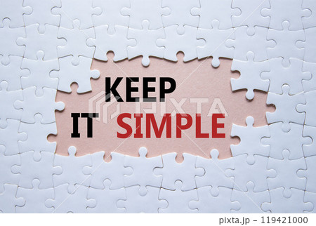 Keep it Simple symbol. Concept words Keep it Simple on white puzzle. Beautiful pink background. Business and Keep it Simple concept. Copy space. 119421000