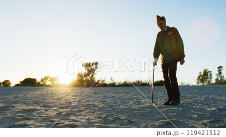 Old American Soldier In Uniform Walking With A Stick 119421512