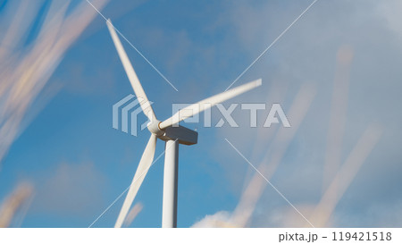 Wind Turbine Rotating With Blue Sky Background 119421518