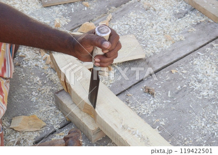 Wooden worker with equipment on farm 119422501