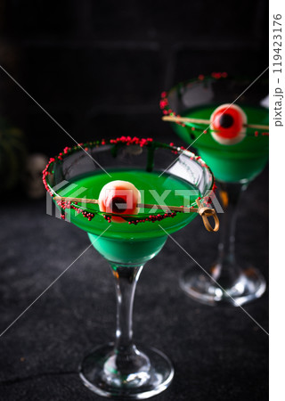 Spooky green Halloween cocktail with eyeball 119423176