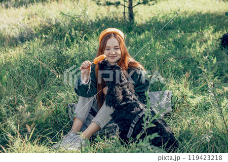 soothing effect of spending time outdoors with pets, ideal for promoting mental health and wellness retreats 119423218