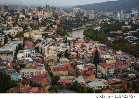 A breathtaking aerial view of Tbilisi showcasing vibrant architecture and dynamic river life A breathtaking aerial view of Tbilisi showcasing vibrant architecture and dynamic river life 119423457