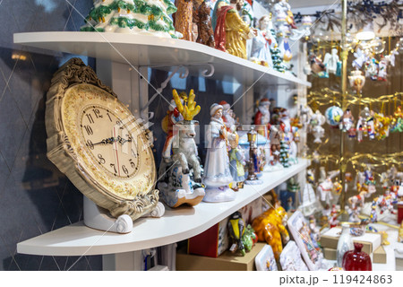 Ceramic Christmas souvenirs on store shelf. Holiday sale Ceramic Christmas souvenirs on store shelf. Holiday sale 119424863