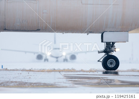 Aircraft fuselage covered with deicing fluid at airport 119425161