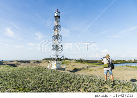 Building view of the Guosheng Lighthouse in Qigu, Tainan, Taiwan. The westernmost point of Taiwan and Taijiang National Park Attractions. Building view of the Guosheng Lighthouse in Qigu, Tainan, Taiwan. The westernmost point of Taiwan and Taijiang National Park Attractions. 119427212