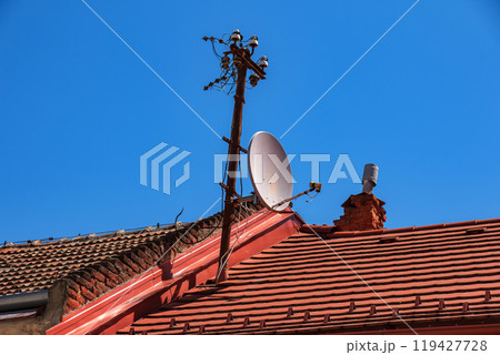Power lines on the roof of the house. Power lines on the roof of the house. 119427728
