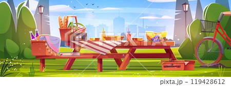 Retro picnic on wooden table in morning city park 119428612