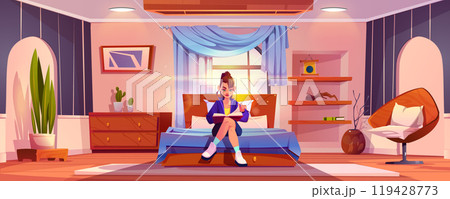 Young girl sitting on bed in bedroom reading book. Young girl sitting on bed in bedroom reading book. 119428773