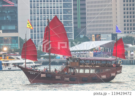 Oct 6 2024 HK Junkboat sailing along Hong Kong Skyline 119429472