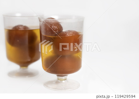 Close-up of delicious Gulab Jamun in transparent glass cups 119429594