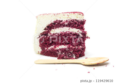 Slice of delicious red velvet cake with wooden spoon on white background Slice of delicious red velvet cake with wooden spoon on white background 119429610