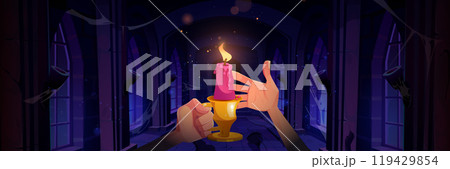 Hand holding candle in medieval castle corridor Hand holding candle in medieval castle corridor 119429854