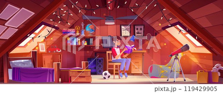 Teen boy reading book in attic bedroom 119429905